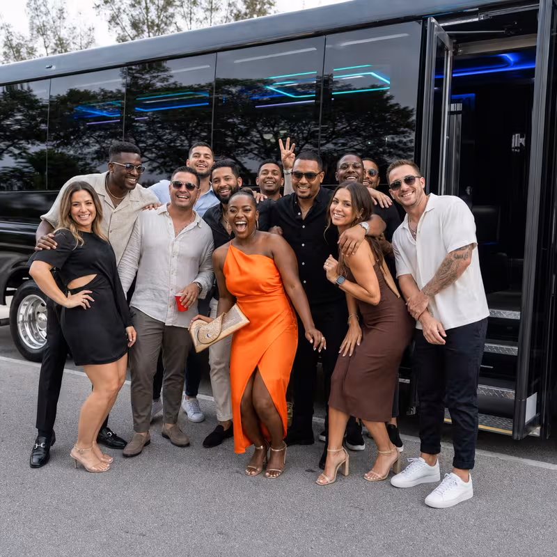 Party bus interior with wraparound leather seating and LED lighting in Phoenix