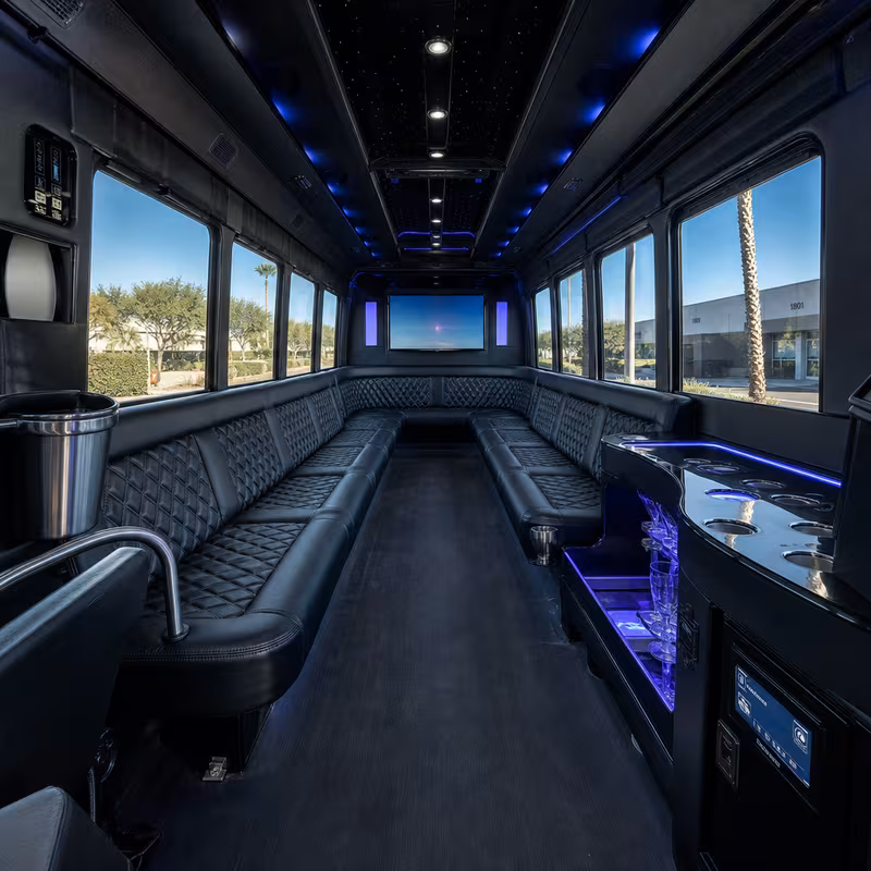 Party bus interior with wraparound leather seating and LED lighting in Phoenix
