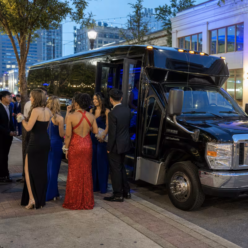 Passengers loading luggage while boarding an Phoenix group shuttle