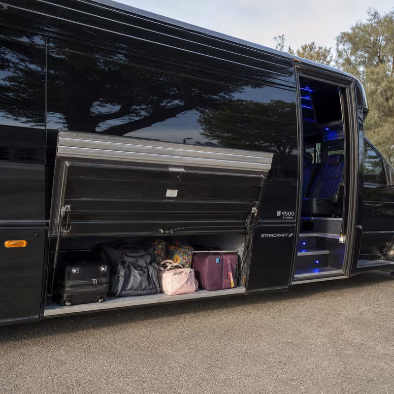 Party bus interior with wraparound leather seating and LED lighting in Phoenix