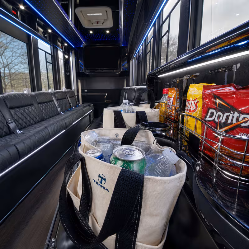 Party bus interior with wraparound leather seating and LED lighting in Phoenix