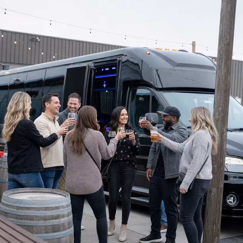 Passengers loading luggage while boarding an Phoenix group shuttle